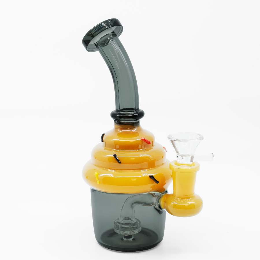 Grey cupcake-shaped glass bong with white frosting top and internal percolator