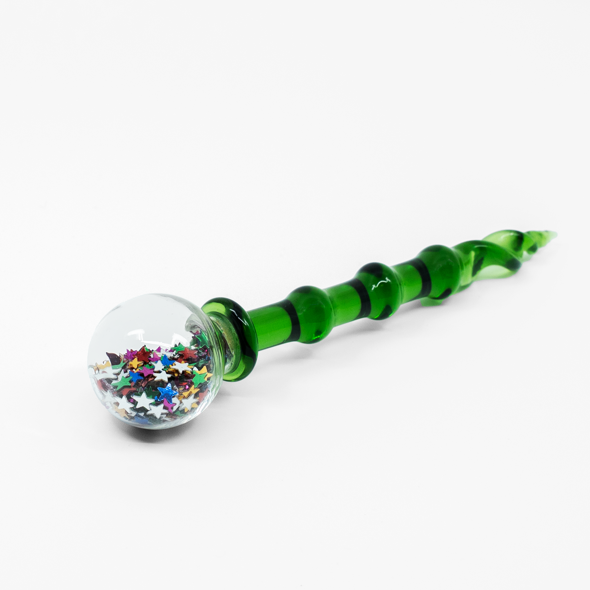 Green twisted glass dab tool with clear orb handle filled with metallic star glitter
