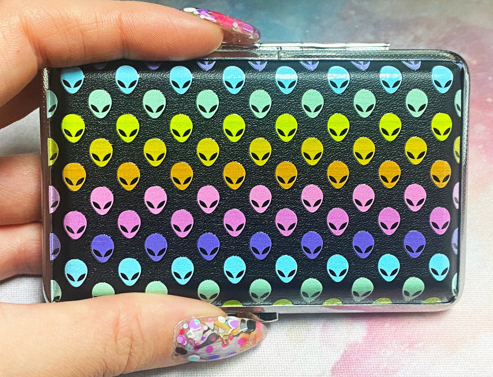 Colorful ALIENS! Joint or Vape Stash Case held in hand, showcasing its cosmic design and vibrant alien motifs.