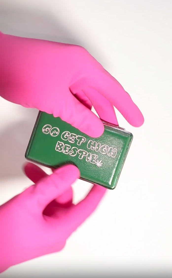 Green “Go Get High Bestie” acrylic smell-proof case with metal insert cutouts and Em Hashh doodle art held by someone in pink gloves video